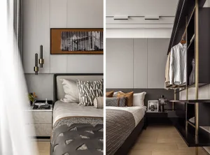 A modern minimalist bedroom with neutral tones, featuring a grey bed, black headboard, and a wooden floor.