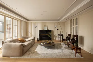 A modern living room featuring a beige sofa with pillows, a glass coffee table, a black piano, and various decorative items.