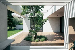 Concrete and wooden exterior of a modern residential building.