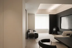 Minimalist living room with neutral tones and clean lines.
