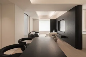 Modern living room with wooden furniture and sleek design elements.