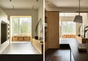 A modern residential interior features wooden furniture and concrete flooring.