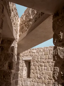 Stone architecture ruins viewed from inside a building.
