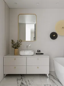 Modern bathroom featuring marble finishes and minimalist design.