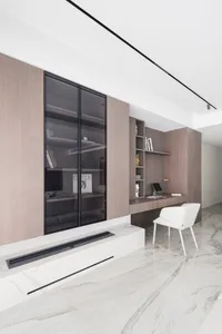 A modern office space featuring wood, glass, and marble materials.