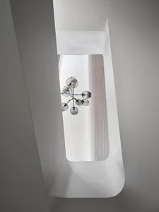 A minimalist interior space featuring a unique glass floor.