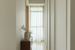 Modern hallway with white walls and wooden floor
