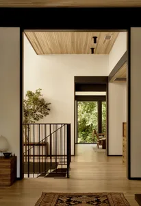 A modern interior space featuring a wood entertainment system.