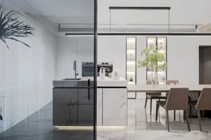 Modern residential kitchen featuring marble countertops and glass cabinets.