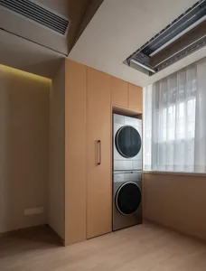 Modern laundry room featuring wooden cabinets, stainless steel washing and drying machines, and an open-air window.