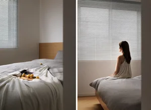 A minimalist bedroom featuring window blinds.