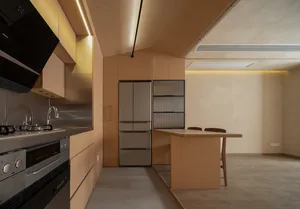 Modern residential kitchen featuring stainless steel appliances and wooden cabinetry.