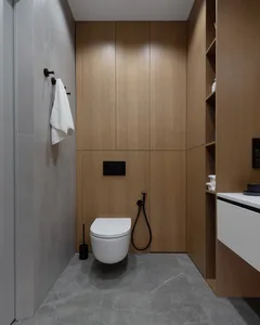 A modern bathroom with wooden panels and grey tiles.