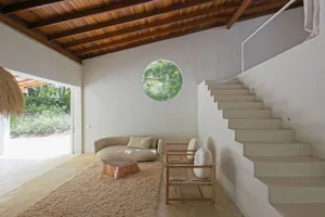 A cozy minimalist living room with wooden elements