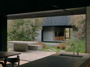 Modern exterior building with concrete and glass materials.