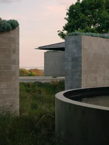 Concrete seating area with minimal design elements outdoors.