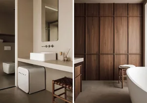 A modern bathroom featuring wood-paneled storage and a minimalist sink area.