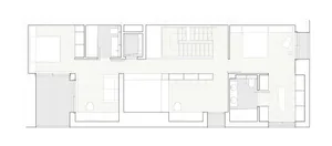 A modern residential floor plan showing wooden flooring and minimalist design.