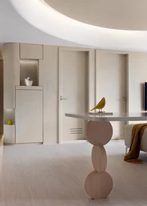 A modern residential interior with minimalist design features, showcasing clean lines and neutral tones