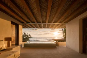 Luxurious minimalist hotel room with wooden accents
