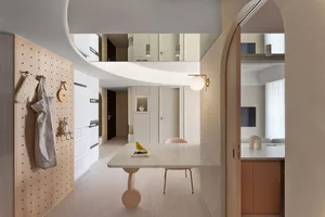 Modern minimalist kitchen and dining area featuring concrete and marble materials.