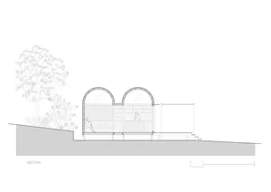 Section view of a modern house showing internal and external architectural details.