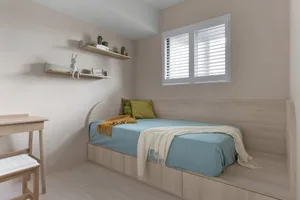 A modern minimalist bedroom featuring a wooden bed and wall shelves.