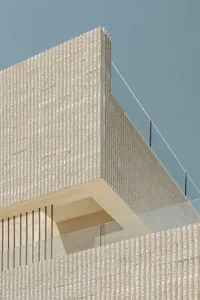 A modern exterior building sculpture made of stone.