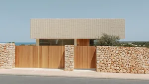 Modern residential building with stone and wood exterior
