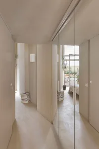 Image of a minimalist interior with concrete walls and floors, showcasing a modern and clean design.