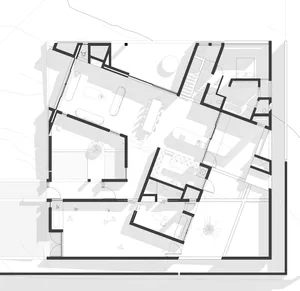 A modern architectural floor plan with a mix of materials and functional spaces.