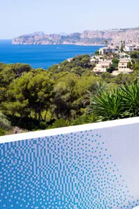 Modern villa with a swimming pool overlooking the sea.