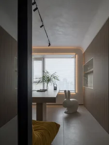 Contemporary home office featuring minimalist design with wooden and marble elements.