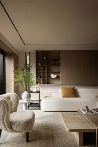 Modern living room featuring a textured fabric sofa and minimalistic design elements.