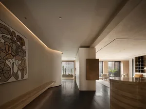 Modern living room featuring minimalist design with neutral tones and sleek finishes.