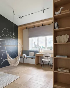 A minimalist interior featuring a wooden floor, a hanging hammock chair, a window seat, a study nook, and a bookshelf.