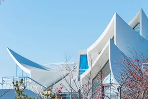 A modern building with glass façade.