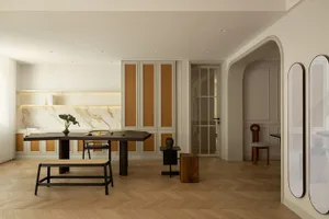 Modern residential kitchen featuring marble countertops and cane furniture.