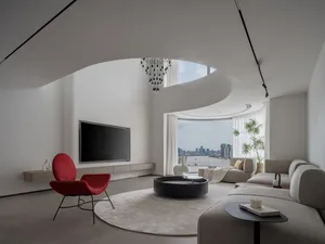 A modern, minimalistic living room features a sleek, grey sectional sofa, a black geometric chandelier, and white curtains, c