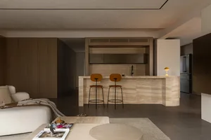 Modern residential kitchen featuring a stone counter with minimalist design.