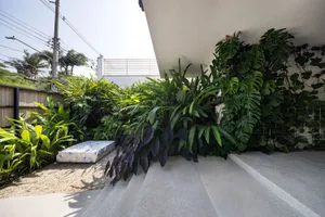 Modern living space with concrete planters and greenery