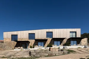 Modern residential building featuring wood and stone materials