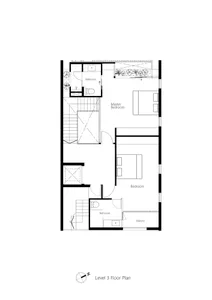 Floor plan of a residential basement interior with two bedrooms, bathrooms, and a balcony.