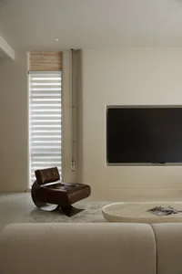 Modern living room with neutral-toned furnishings and a minimalist design.