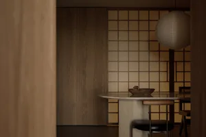A modern restaurant interior featuring wooden elements and a minimalist design.