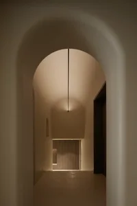 A modern corridor with curved plaster walls