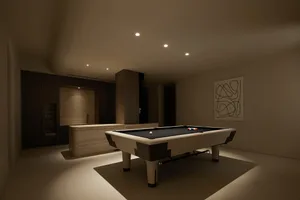 A modern minimalist entertainment room featuring a pool table with a black felt top and colored balls, set against a wooden f