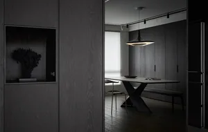 Modern dining room with dark wood furniture and minimalist design.