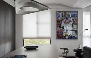 Modern dining room featuring marble tabletop, timber chairs, and pleated light filtering shades.