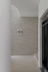 Minimalist interior design featuring brick and concrete materials